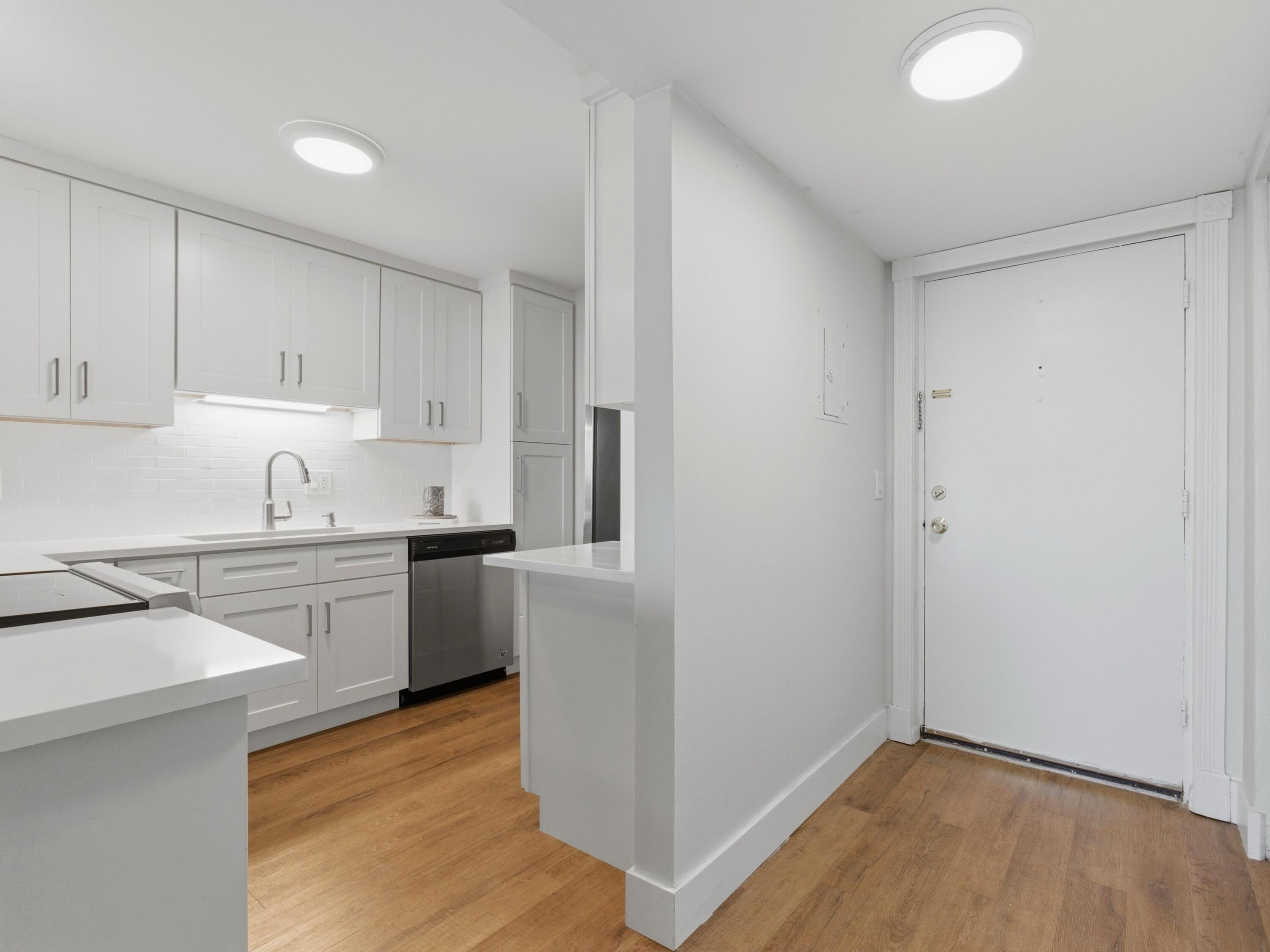 5500 Northwest 2nd Avenue, Unit 519 Boca Raton, FL 33487 - Photo 3 of 48 a kitchen with a sink cabinets stainless steel appliances and a counter space