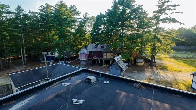 swimming pool view with a seating space
