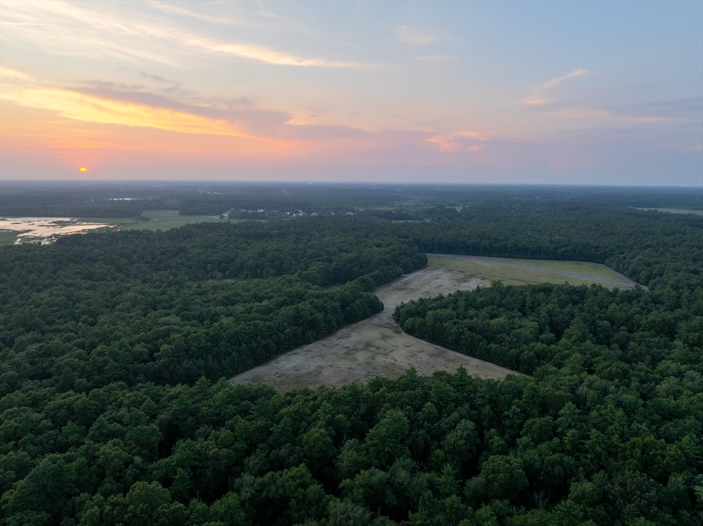 235 South Main Street Carver, MA 02330 - Photo 28 of 34 a view of a pathway both side of grassy field with shrub