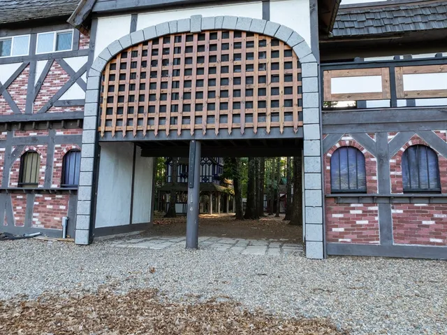 a view of a brick house with large windows