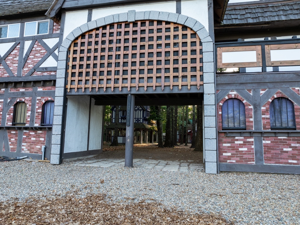 235 South Main Street Carver, MA 02330 - Photo 4 of 34 a view of a brick house with large windows