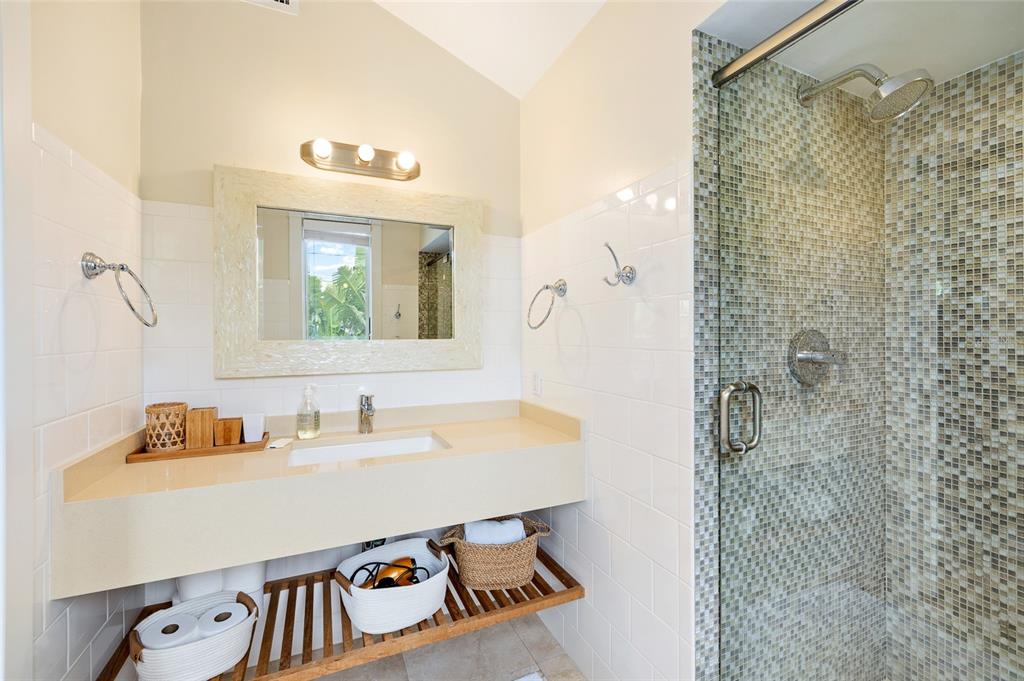 340 Palm Avenue Boca Grande, FL 33921 - Photo 24 of 38 a bathroom with a sink and a mirror