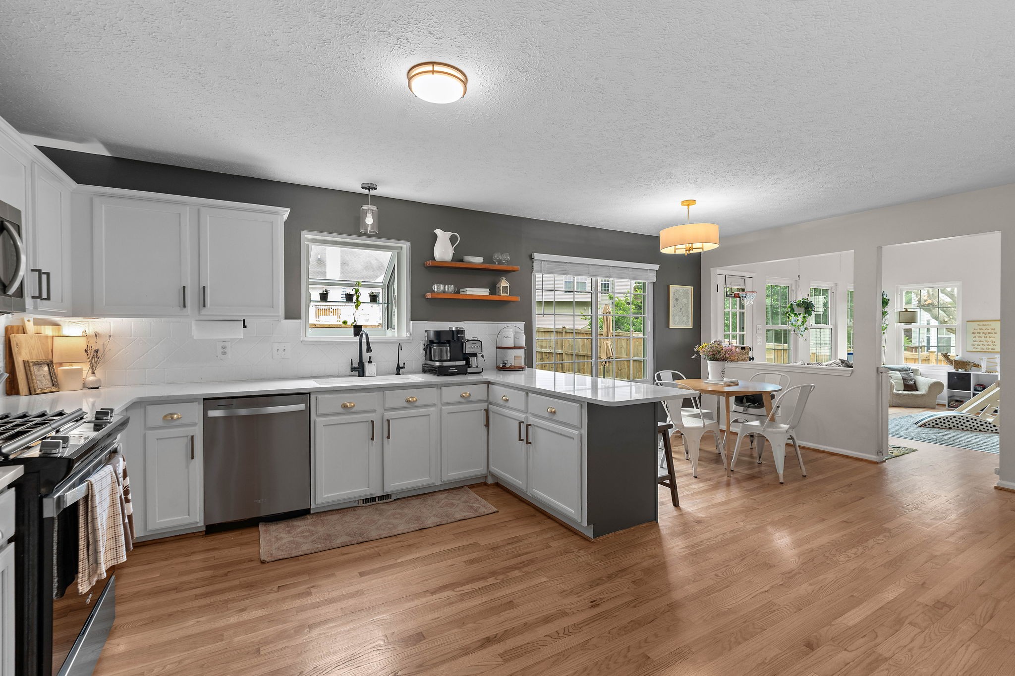 2104 Melody Drive Franklin, TN 37067 - Photo 13 of 30 a kitchen with a sink cabinets wooden floor and stainless steel appliances