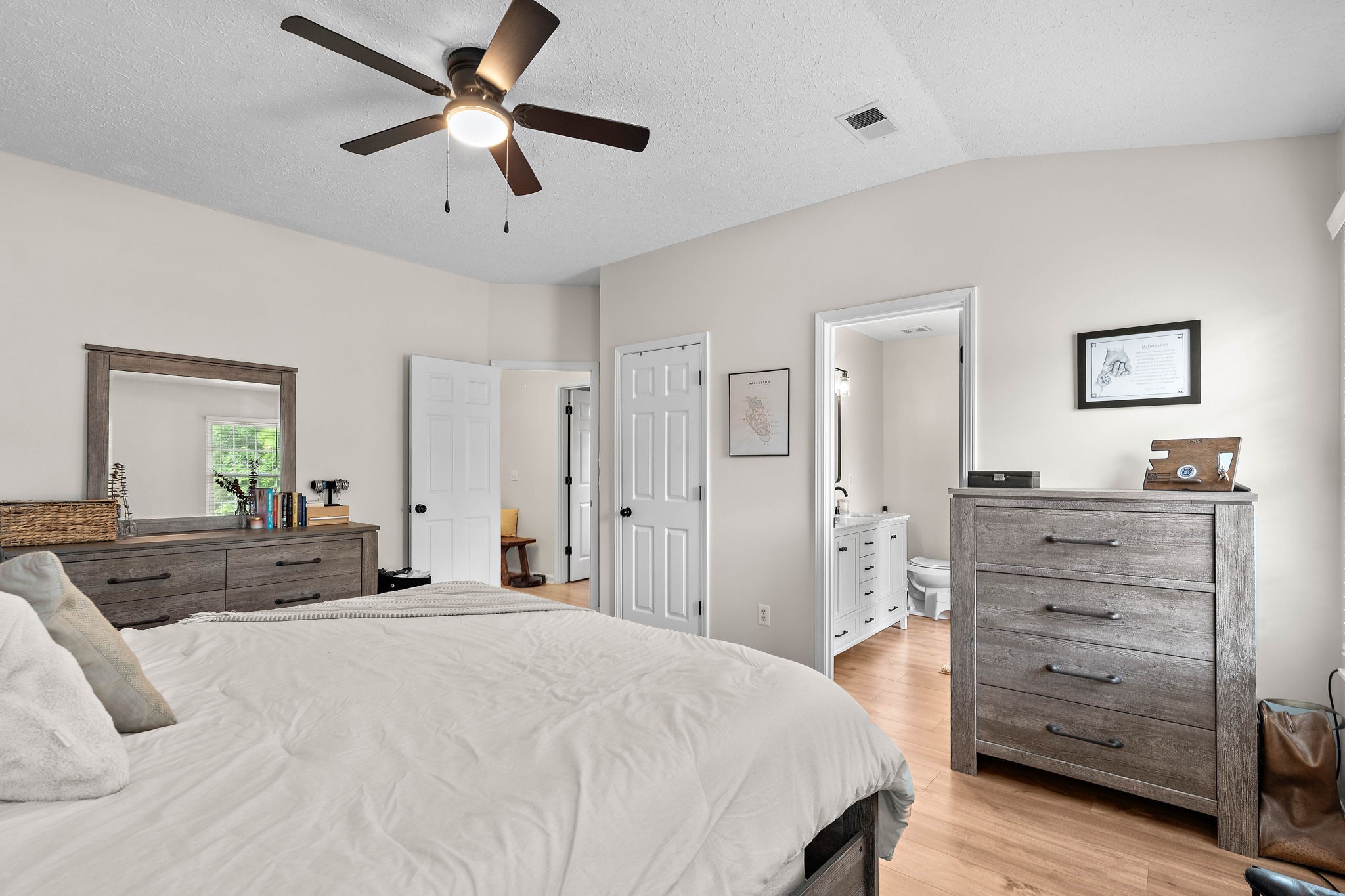 2104 Melody Drive Franklin, TN 37067 - Photo 19 of 30 a bedroom with a bed and a chandelier