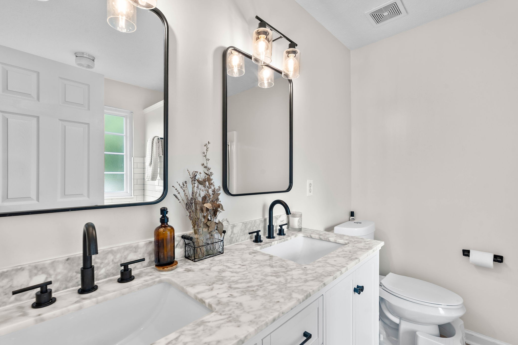 2104 Melody Drive Franklin, TN 37067 - Photo 20 of 30 a bathroom with a granite countertop sink and a mirror