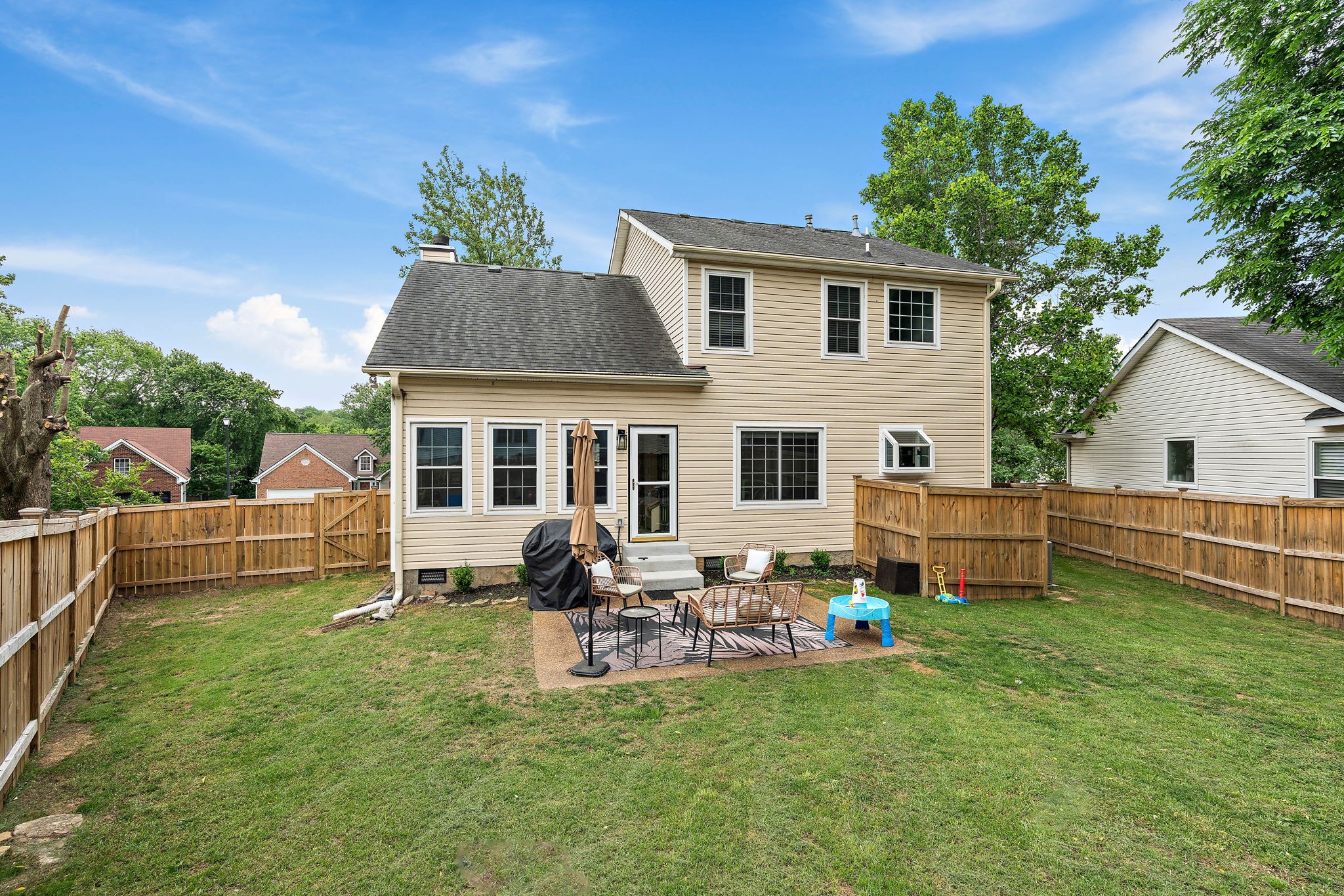2104 Melody Drive Franklin, TN 37067 - Photo 30 of 30 a view of a house with backyard sitting area and garden