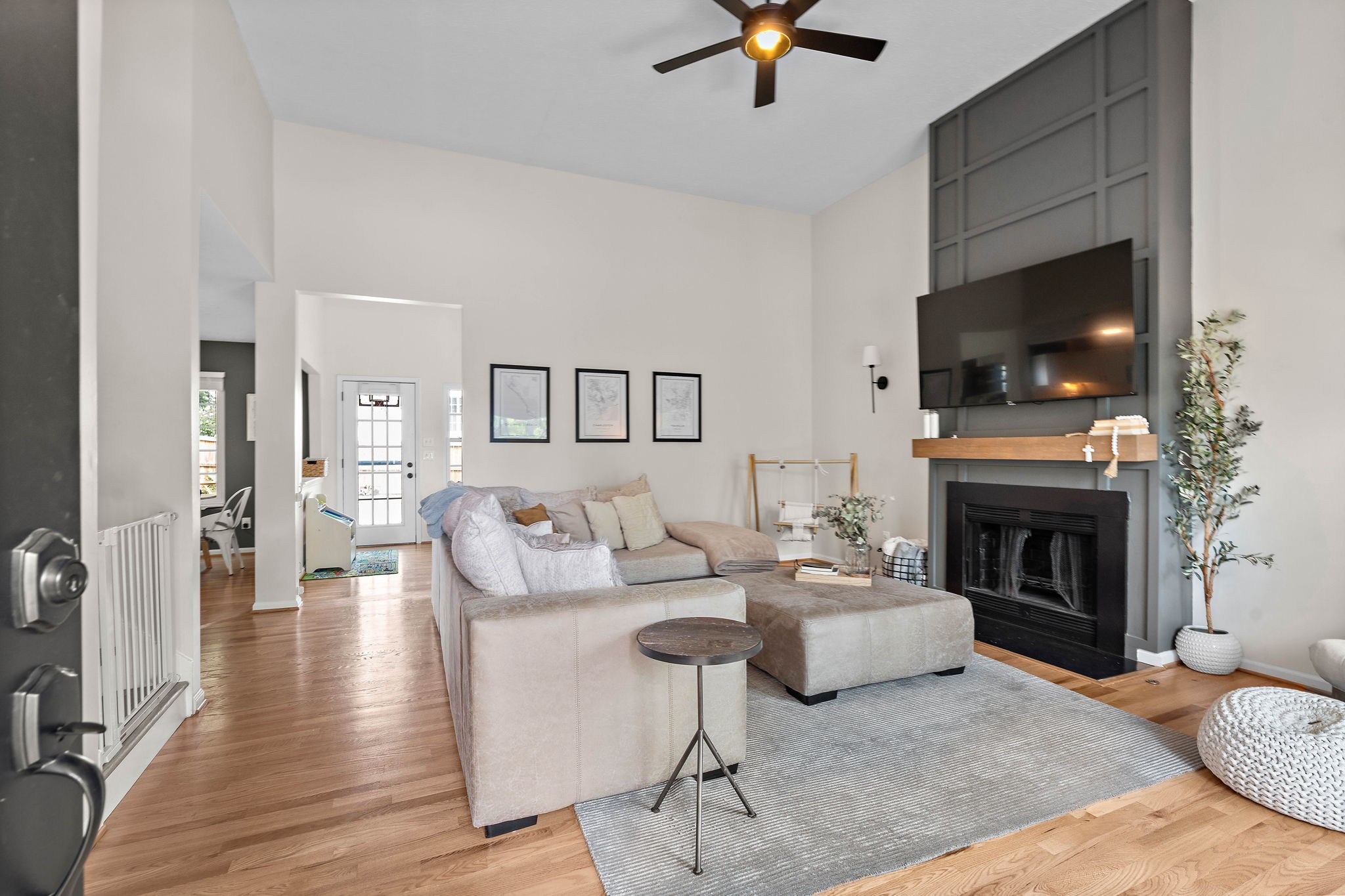 2104 Melody Drive Franklin, TN 37067 - Photo 6 of 30 a living room with furniture a flat screen tv and a fireplace