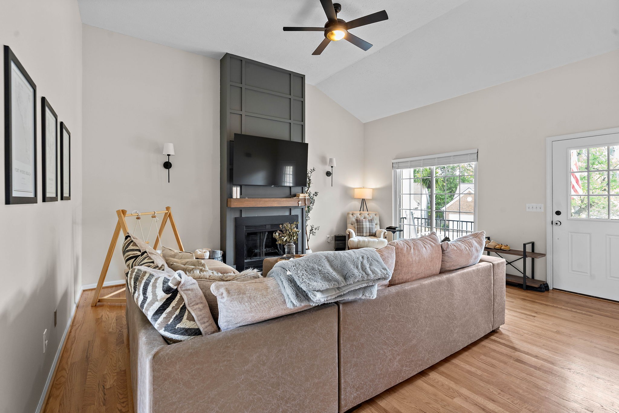 2104 Melody Drive Franklin, TN 37067 - Photo 7 of 30 a living room with furniture a fireplace and a flat screen tv