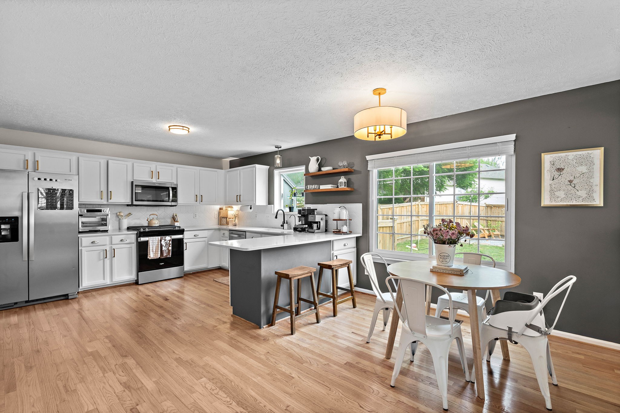 2104 Melody Drive Franklin, TN 37067 - Photo 10 of 30 a kitchen with a dining table chairs appliances and cabinets