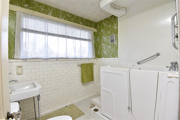 284 Pond Street Boston, MA 02130 - Photo 15 of 27 a bathroom with a sink and a shower