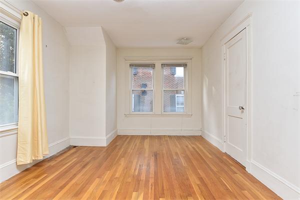 284 Pond Street Boston, MA 02130 - Photo 17 of 27 a view of empty room with wooden floor and fan