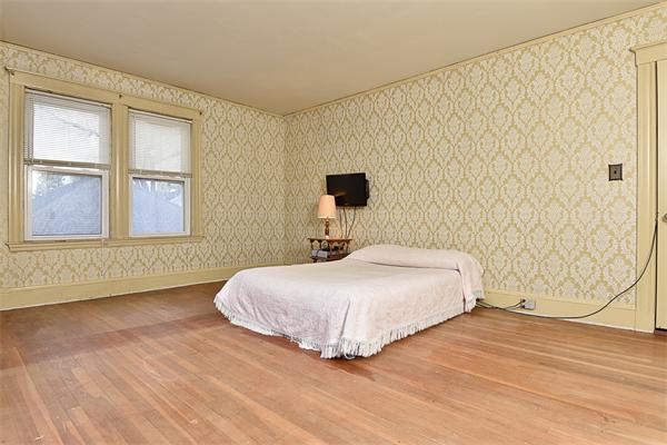 284 Pond Street Boston, MA 02130 - Photo 18 of 27 a bedroom with a bed and a window