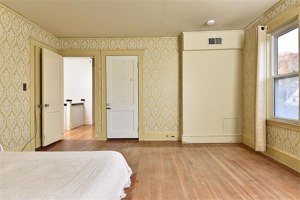 284 Pond Street Boston, MA 02130 - Photo 19 of 27 a view of a room with wooden floor and windows
