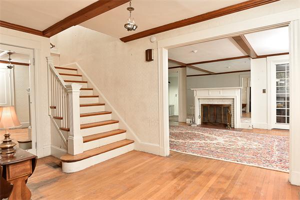 284 Pond Street Boston, MA 02130 - Photo 3 of 27 a view of a livingroom with wooden floor and fireplace
