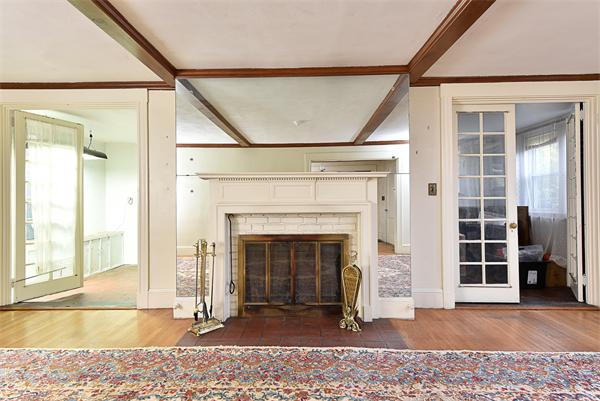 284 Pond Street Boston, MA 02130 - Photo 4 of 27 a view of a livingroom with a fireplace and window