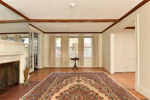 284 Pond Street Boston, MA 02130 - Photo 6 of 27 a front door with a couch and a fireplace