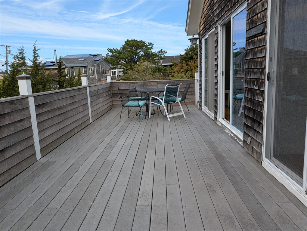 44 Old Point Road Newbury, MA 01951 - Photo 2 of 7 a balcony with wooden floor table and chairs