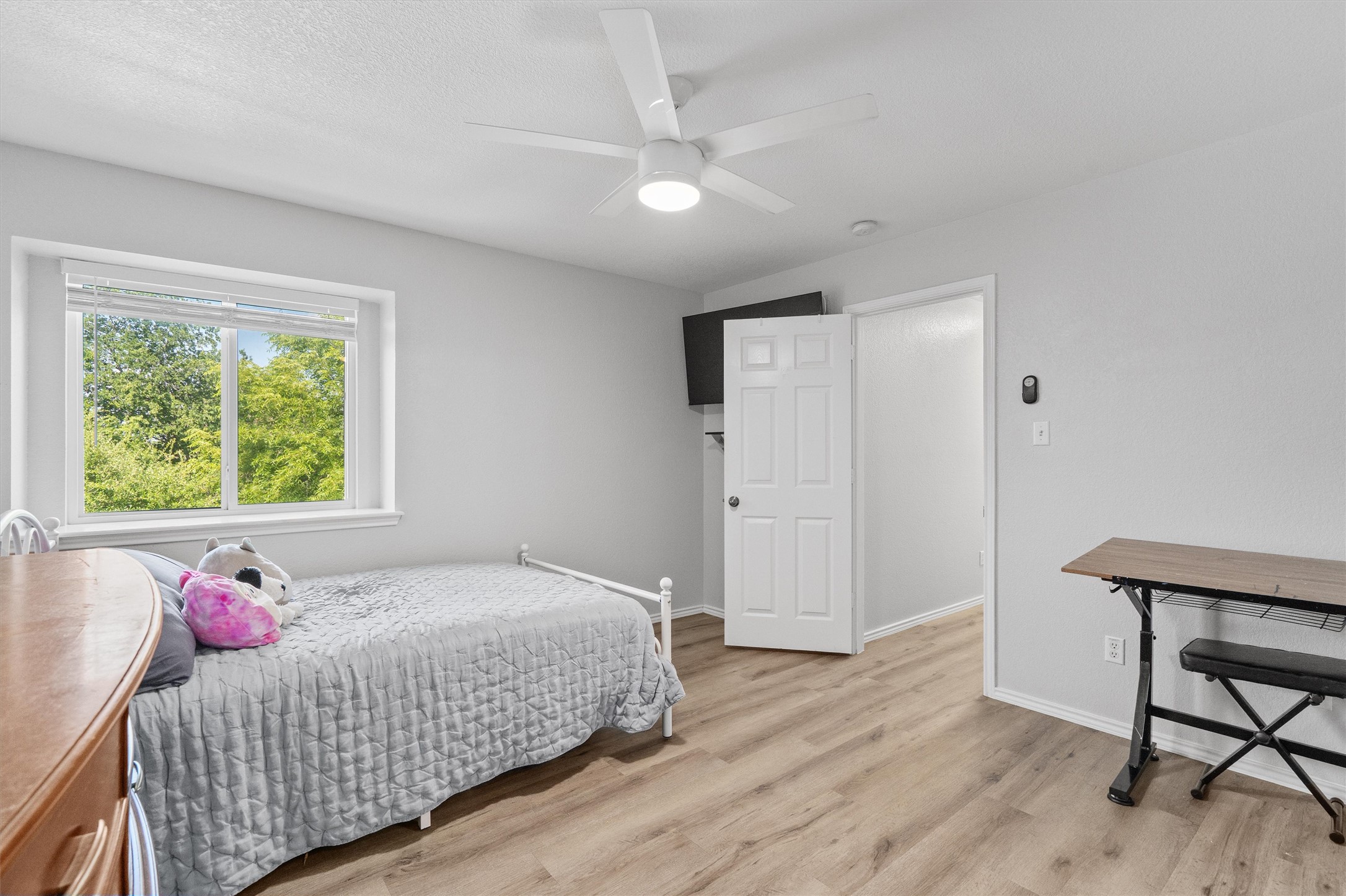 1833 Thompson Trail Round Rock, TX 78664 - Photo 30 of 40 A well-lit bedroom with modern flooring and a peaceful window view.