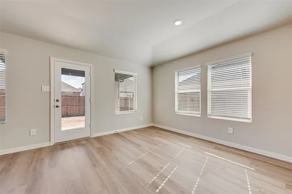 a view of an empty room with a window