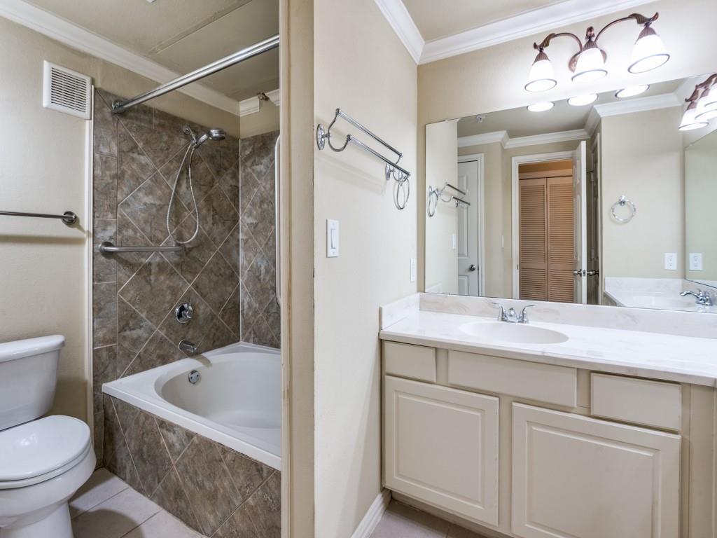 2601 Preston Road, Unit 6109 Plano, TX 75093 - Photo 11 of 16 a bathroom with a granite countertop sink a toilet and shower