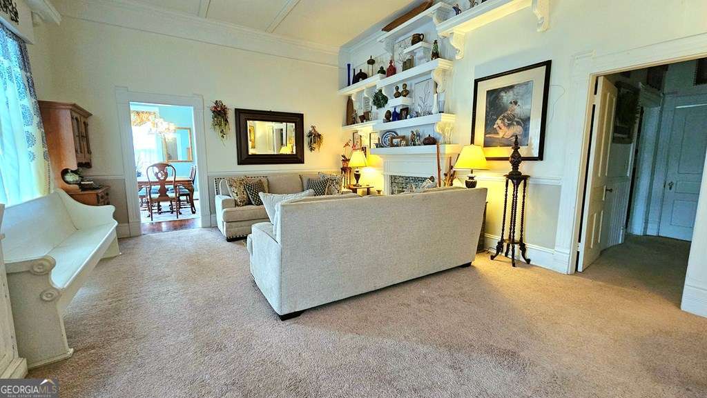 810 South Lee Street, Unit 3 Fitzgerald, GA 31750 - Photo 5 of 22 a living room with furniture and a flat screen tv