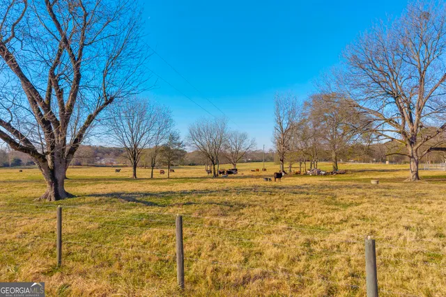 a view of a swimming pool with an outdoor seating