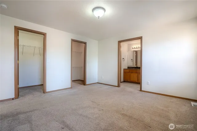 an empty room with a bathroom