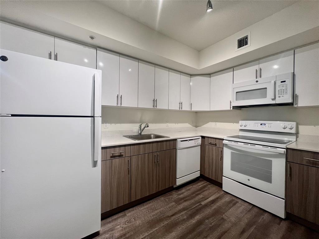 18335 Northwest 68th Avenue, Unit 255308 Hialeah, FL 33015 - Photo 1 of 17 a kitchen with stainless steel appliances granite countertop a sink stove and refrigerator