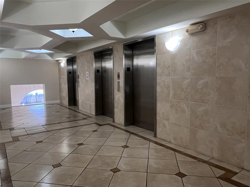 18335 Northwest 68th Avenue, Unit 255308 Hialeah, FL 33015 - Photo 11 of 17 a view of a hallway