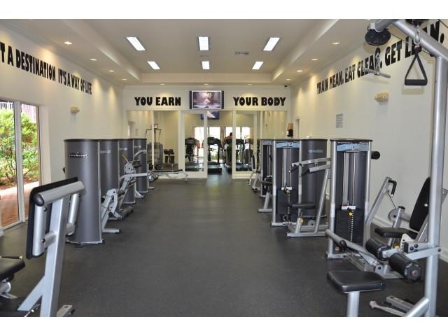 18335 Northwest 68th Avenue, Unit 255308 Hialeah, FL 33015 - Photo 12 of 17 a view of a room with gym equipment