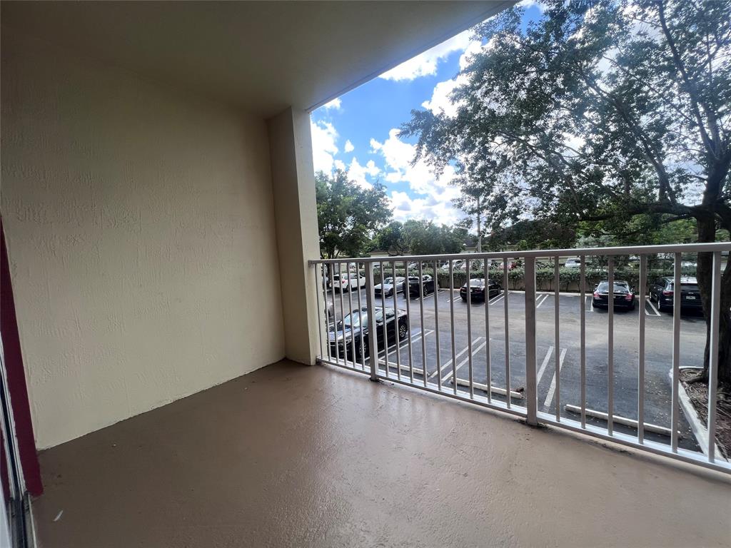 18335 Northwest 68th Avenue, Unit 255308 Hialeah, FL 33015 - Photo 9 of 17 a view of balcony with city view