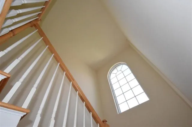 a view of staircase with rug floor