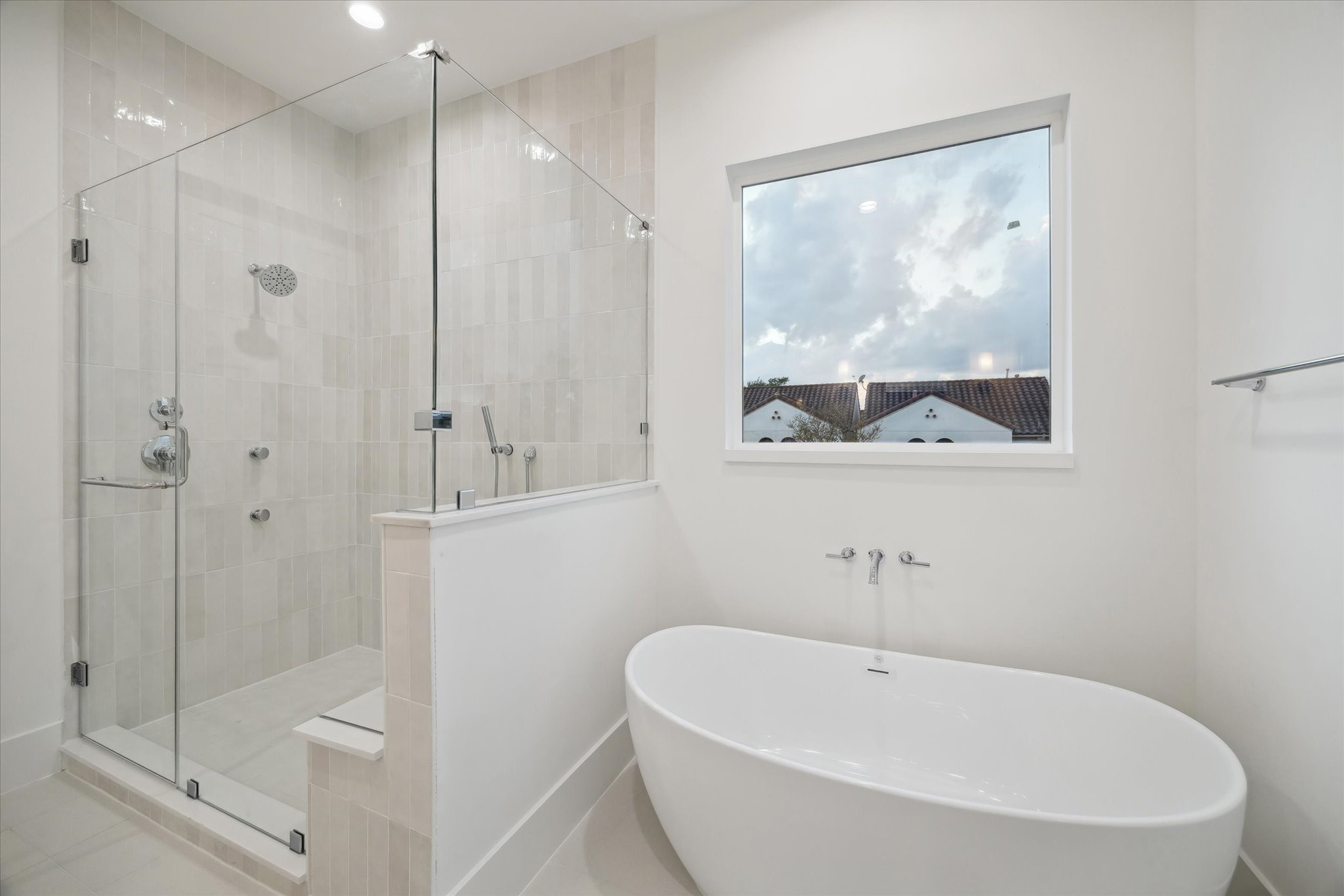 4229 Gibson Street Houston, TX 77007 - Photo 16 of 26 Alternate view with standalone soaking tube, seamless glass shower and peak into primary suite.