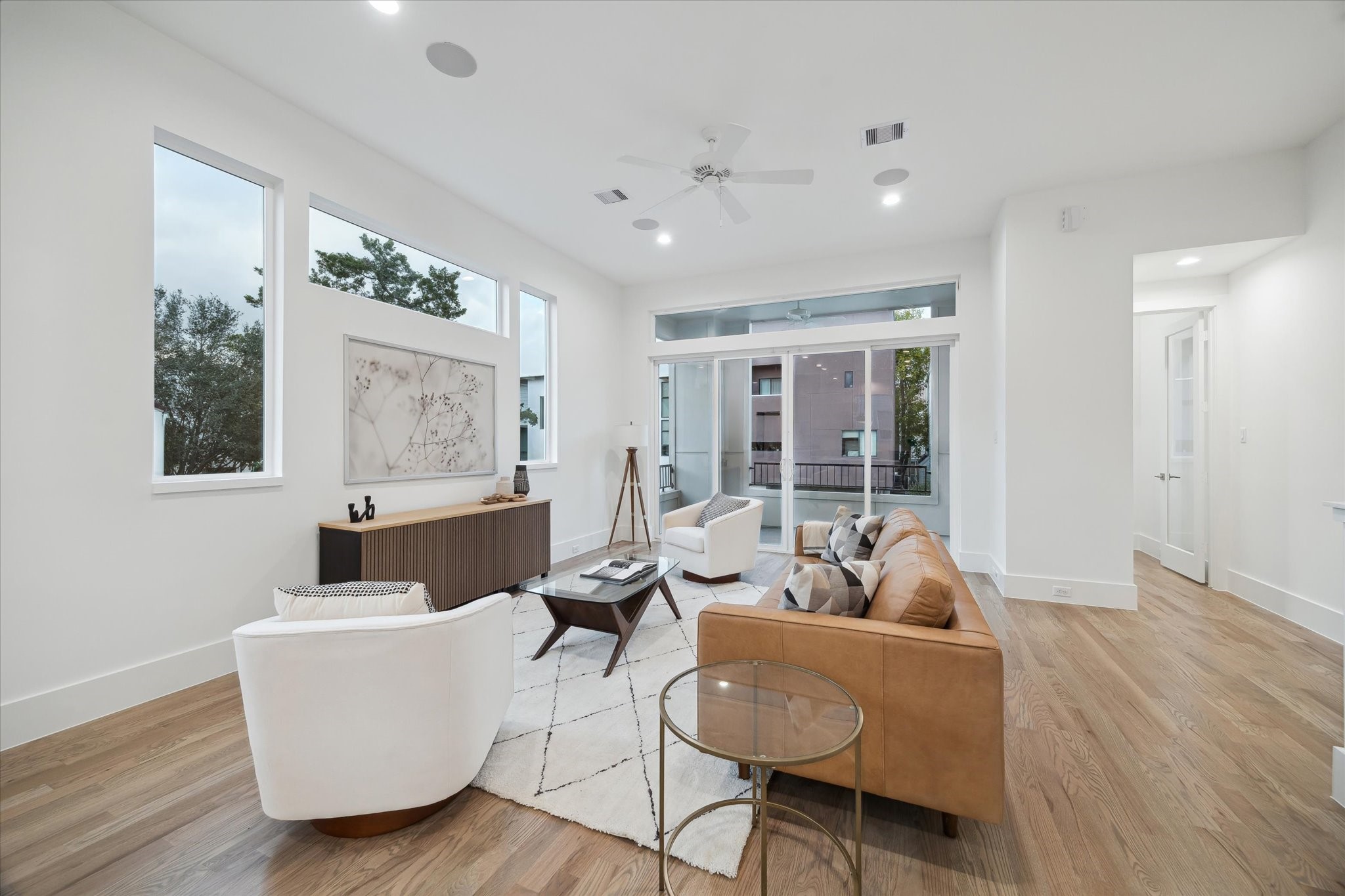 4229 Gibson Street Houston, TX 77007 - Photo 8 of 26 A home with sleek design and exceptional premium finishes, natural light, gleaming red oak hardwood floors, outdoor patio balcony, YARD and bonus office space or flex room!