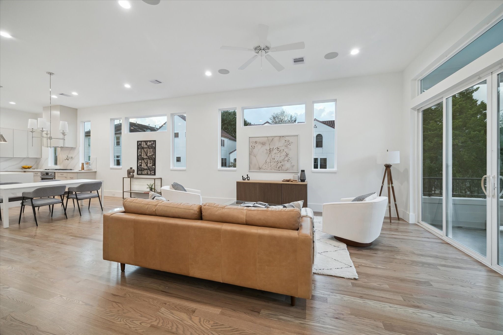 4229 Gibson Street Houston, TX 77007 - Photo 9 of 26 A transitional living room overlooking outdoor terrace and views to kitchen and dining.