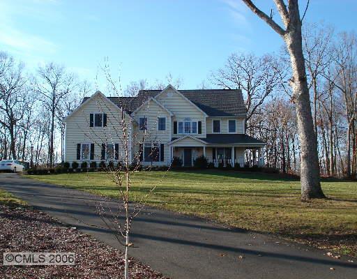 9 Winton Farm Road Newtown, CT 06470 - Photo 1 of 1 a view of a big house with a big yard and large trees