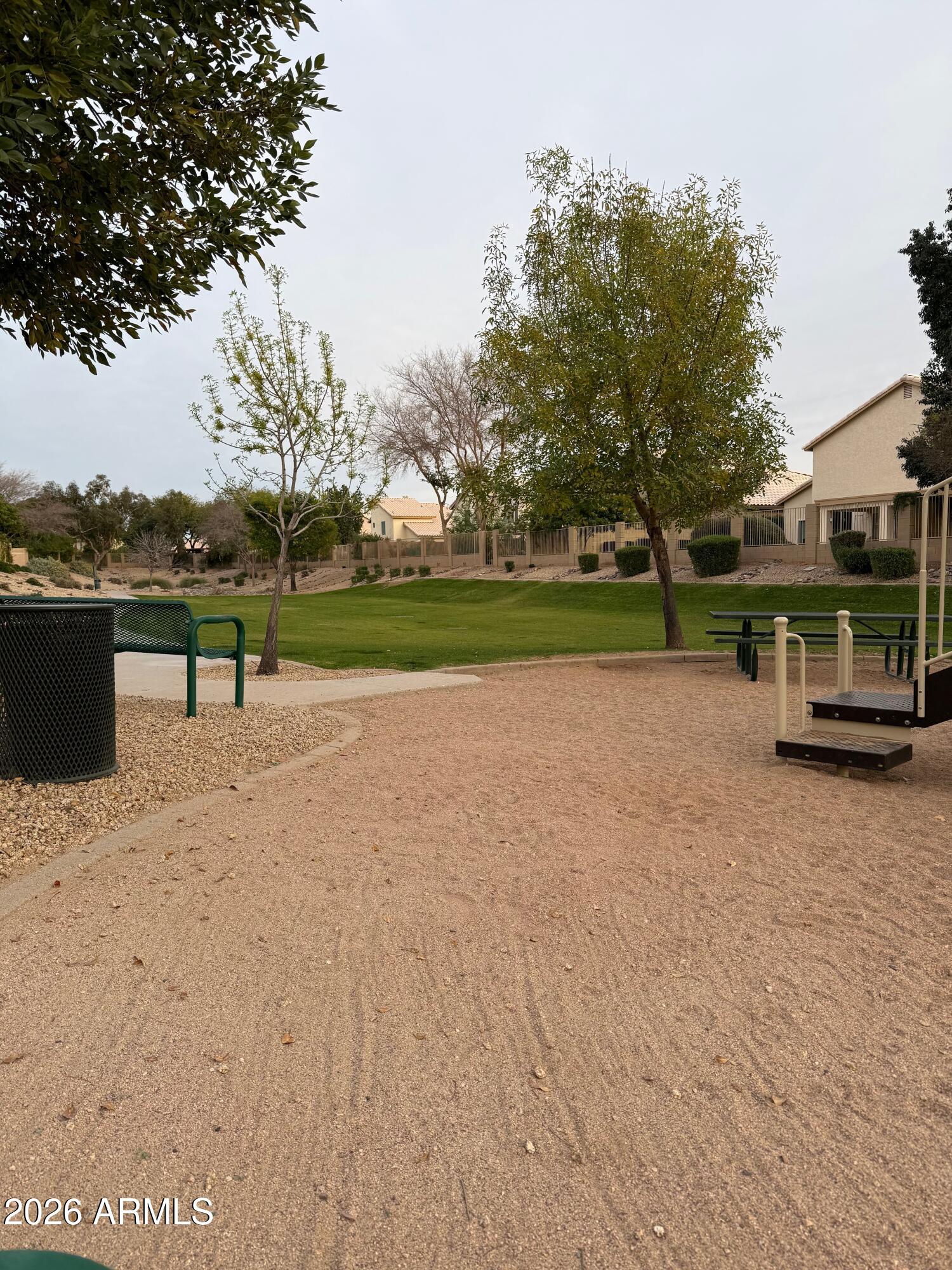 3426 East Clark Road Phoenix, AZ 85050 - Photo 42 of 48 a view of a street with a bench and trees