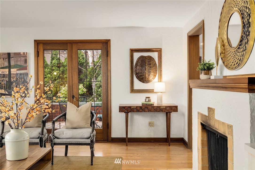 4706 West Ruffner Street Seattle, WA 98199 - Photo 13 of 27 a living room with furniture a window and a fireplace