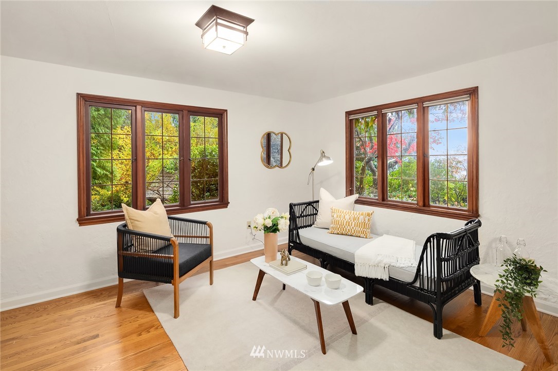 4706 West Ruffner Street Seattle, WA 98199 - Photo 18 of 27 a living room with furniture and a window