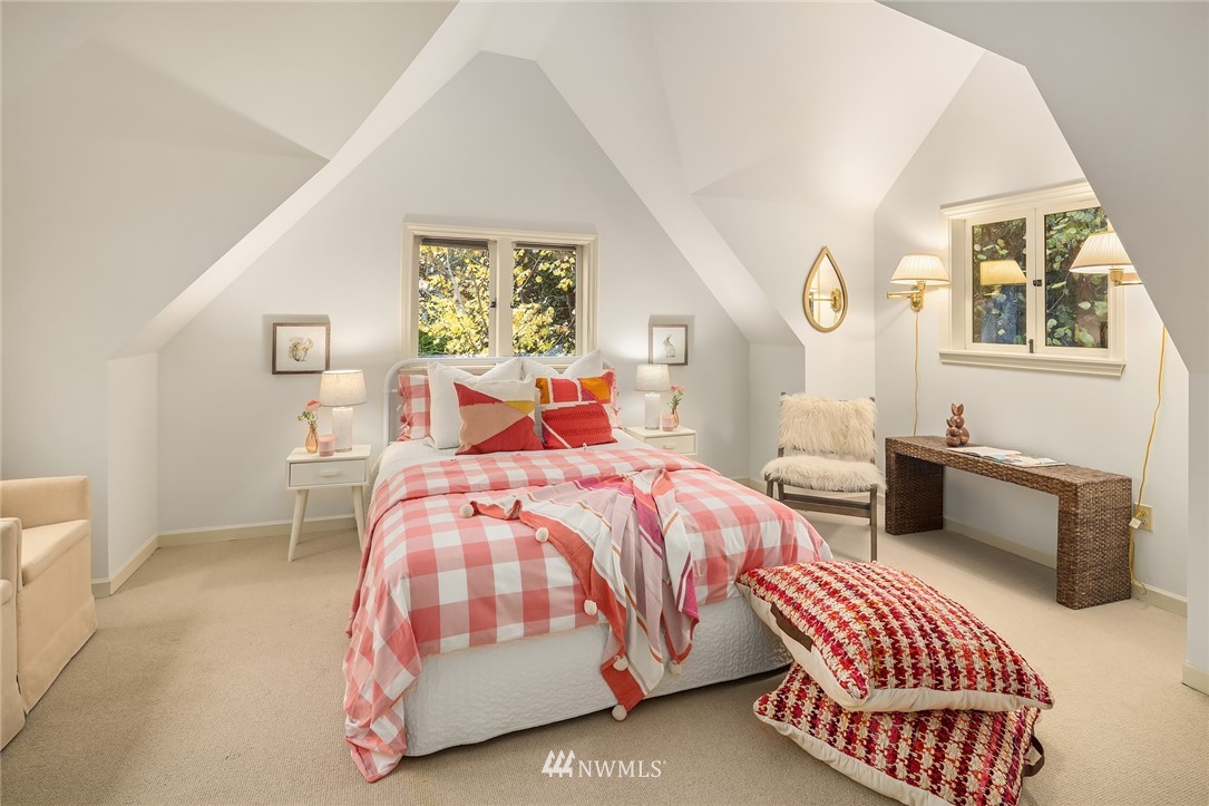 4706 West Ruffner Street Seattle, WA 98199 - Photo 20 of 27 a bedroom with a bed and a painting on the wall