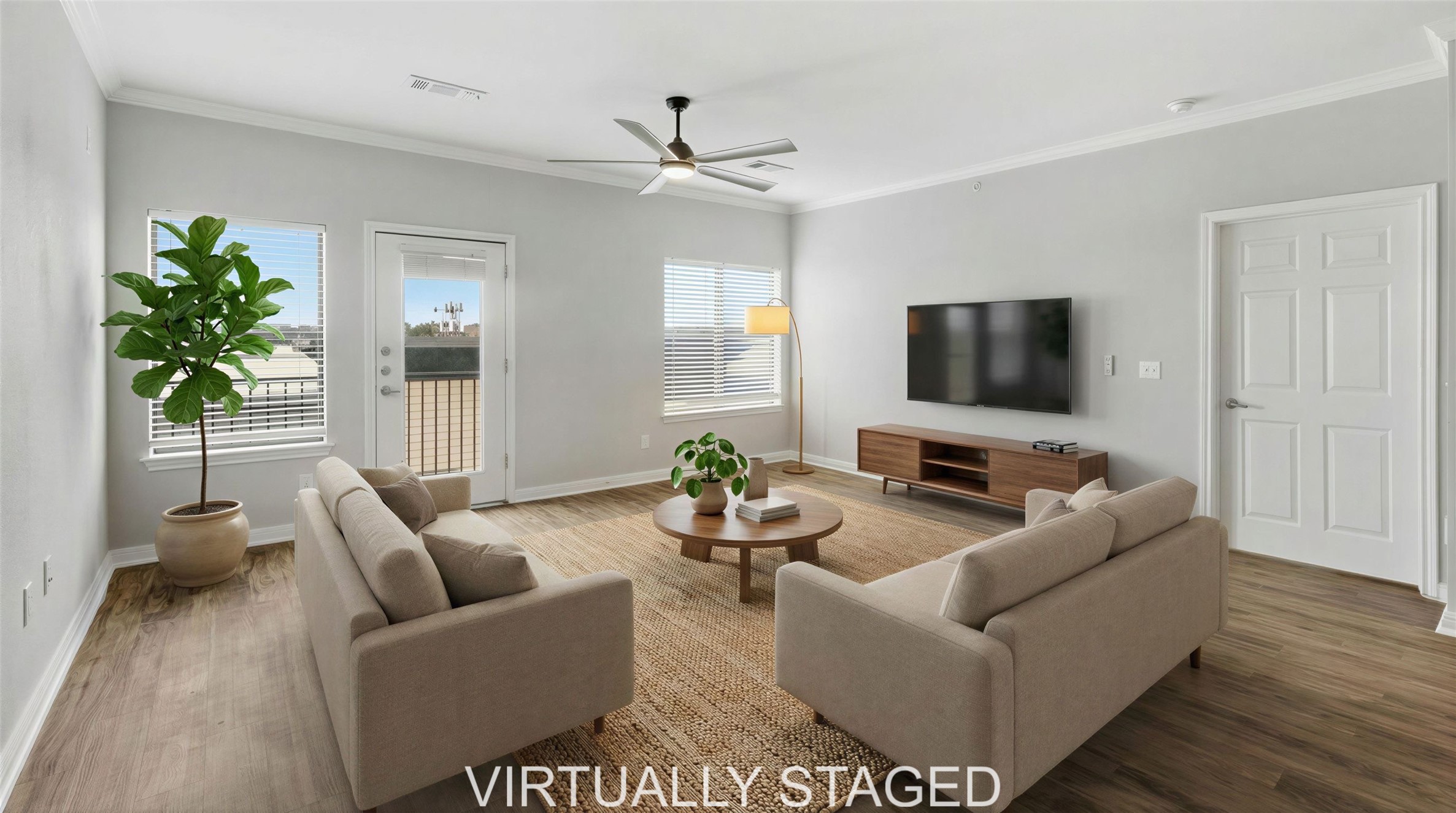 2502 Leon Street, Unit 414 Austin, TX 78705 - Photo 2 of 21 a living room with furniture and a flat screen tv
