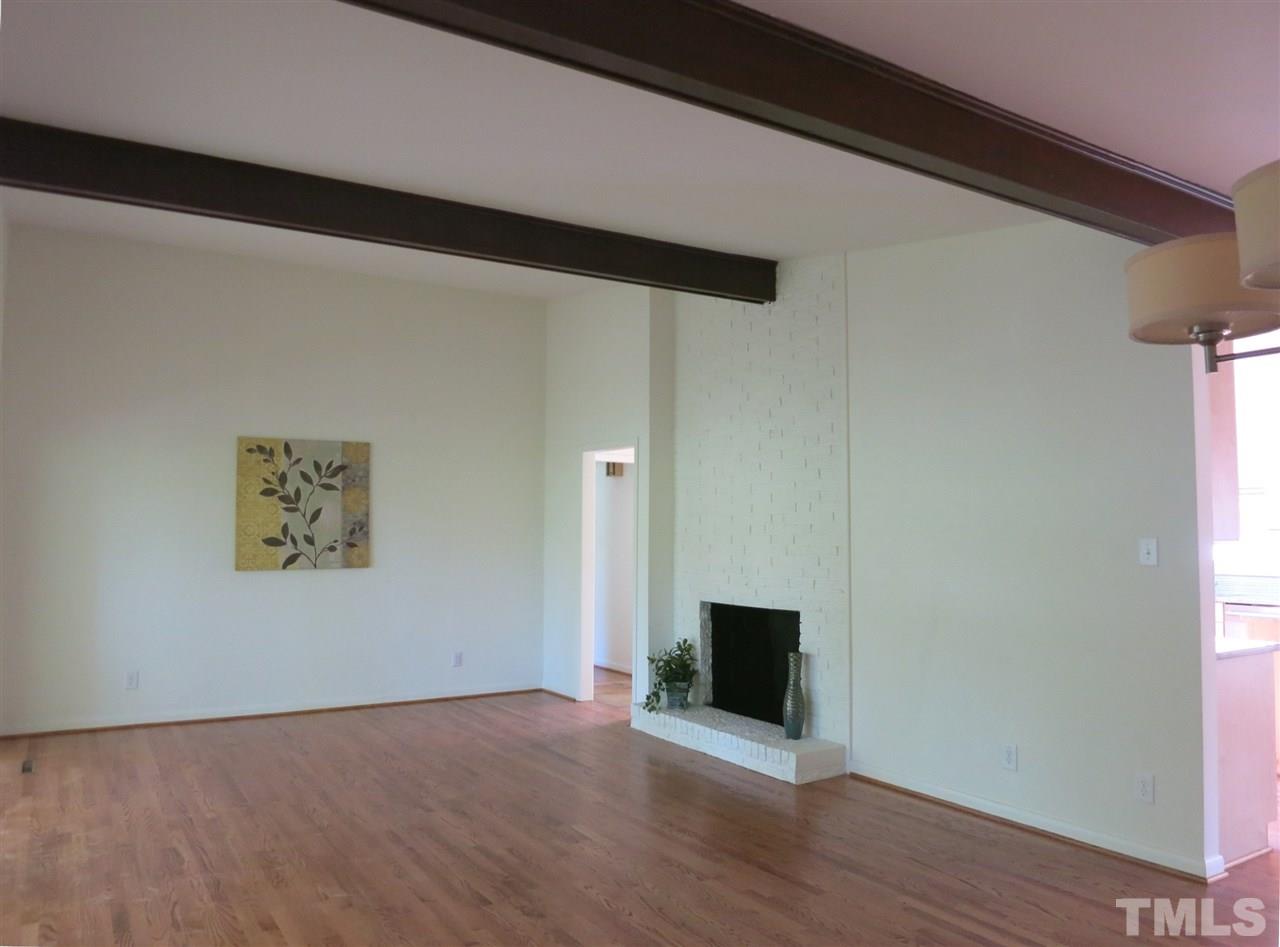 600 Davidson Street Raleigh, NC 27609 - Photo 3 of 25 NEW roof 2016, NEW carpet throughout, RENOVATED Kitchen. Hardwood flrs & vaulted ceilings throughout the open living area; Living Rm is open to the Dining Rm and offers ceiling beams, floor-to-ceiling brick FP & 2 sets of sliders to the Screened Porch.