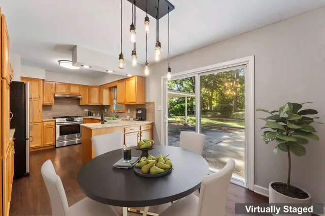 a kitchen with a table and chairs