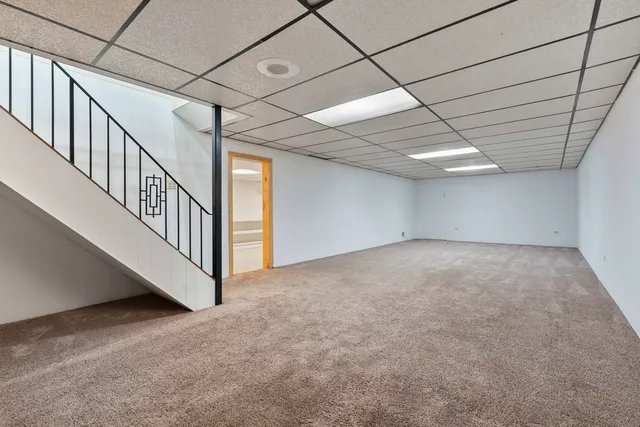 a view of an empty room with windows