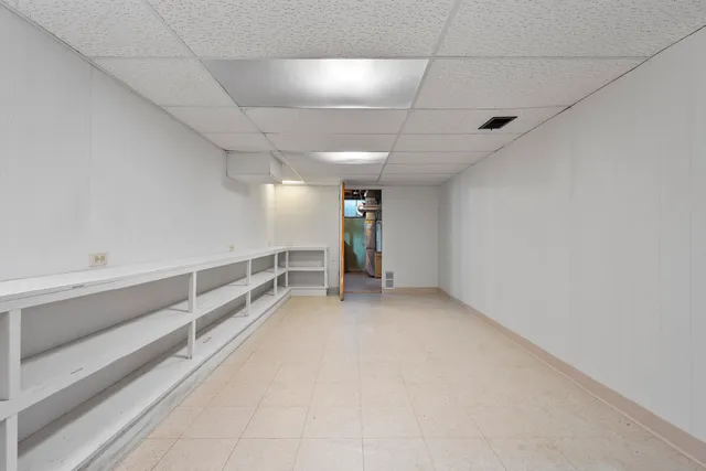 a view of an empty room with a fireplace