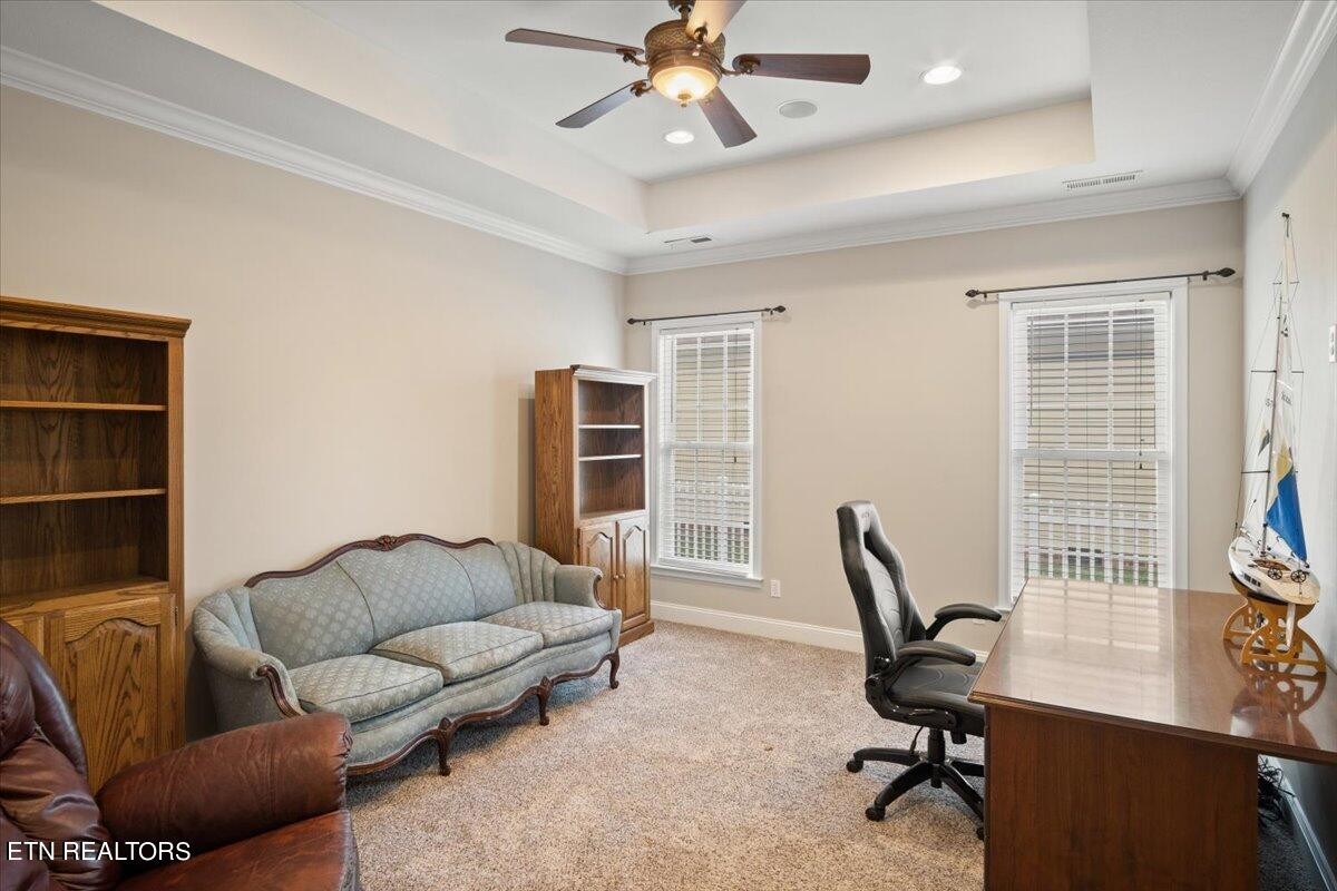 179 Liberty Court Oak Ridge, TN 37830 - Photo 8 of 19 a living room with furniture a window and a flat screen tv