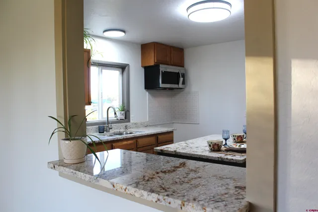 a dining room with a table and chairs