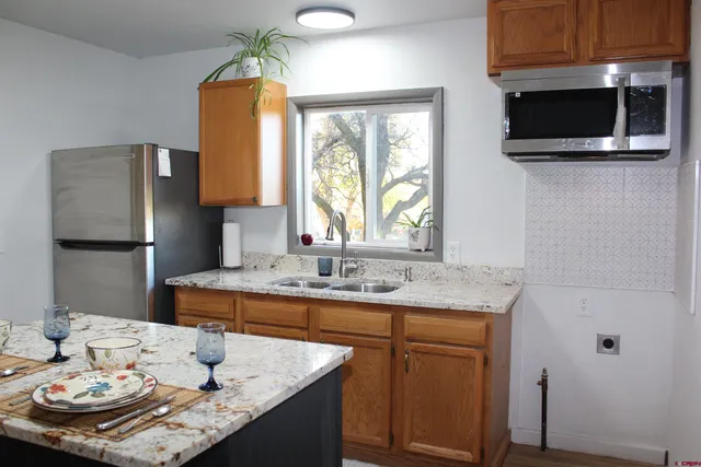 a dining room with a table and chairs