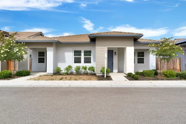 front view of a house with a yard