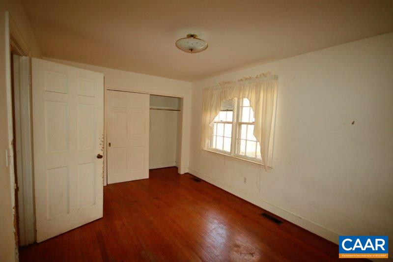 270 East River Road Fork Union, VA 23055 - Photo 10 of 22 a view of an empty room with wooden floor and a window